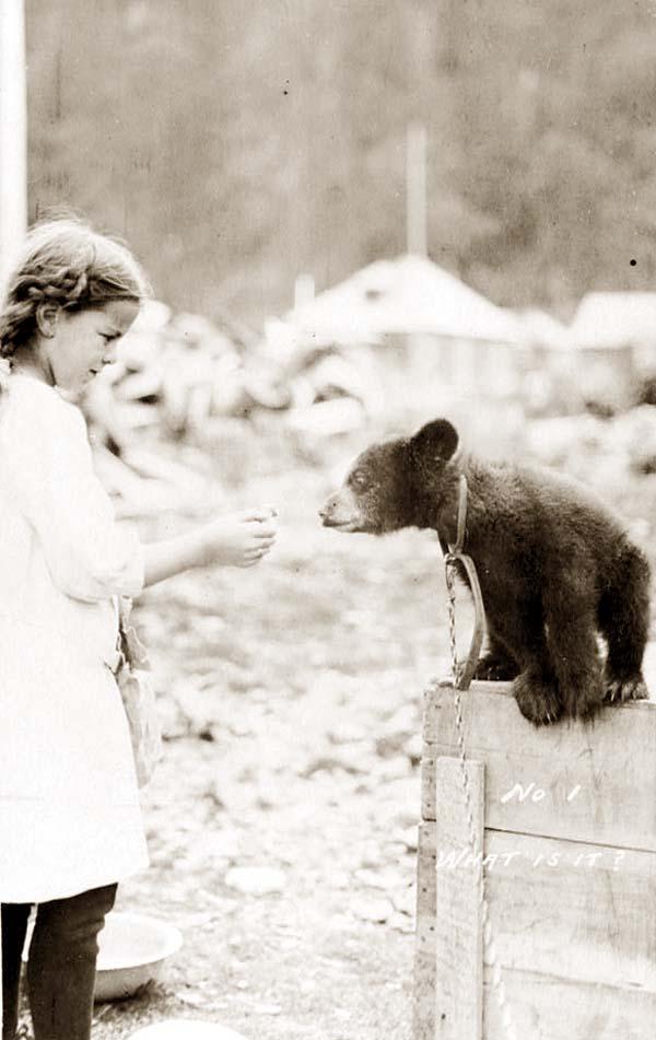 Girl and bear cub