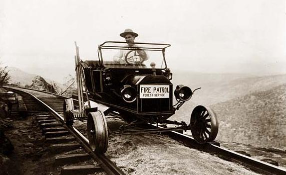 Car Driving on Railroad Tracks