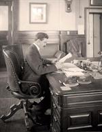 Man Working at Old Desk