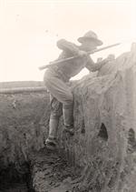 Soldier Climbing Out of Trench
