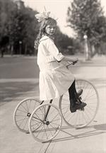 Girl Riding Tricycle